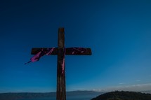 purple shroud on a wooden cross