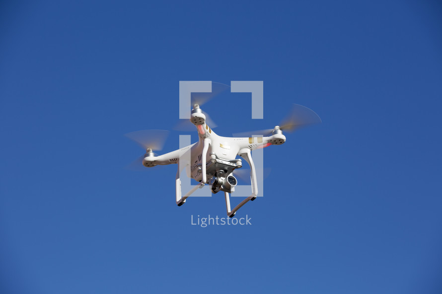 drone in flight against a blue sky