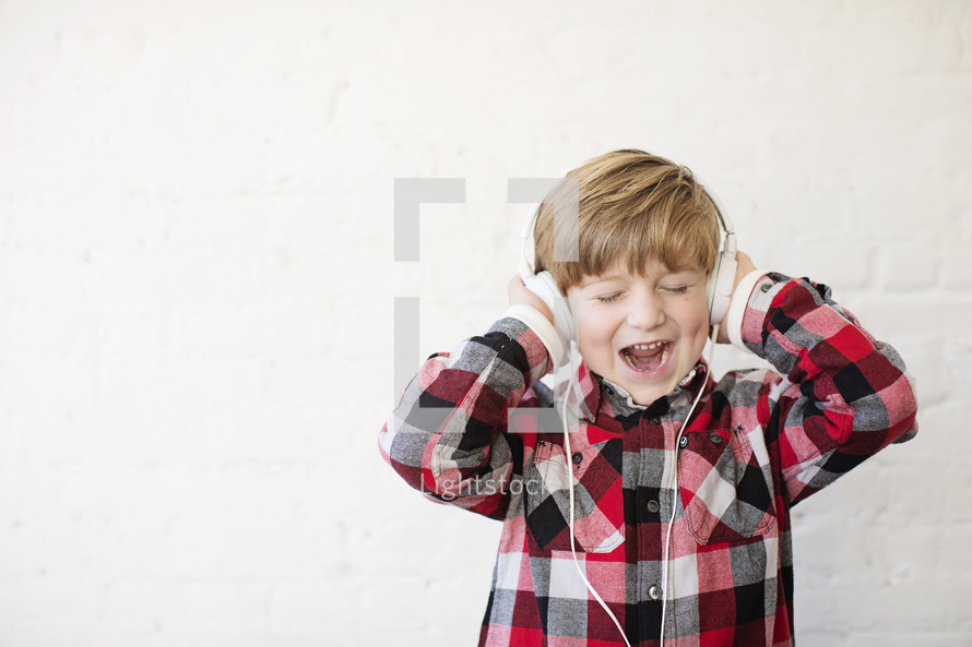 a boy child wearing headphones 