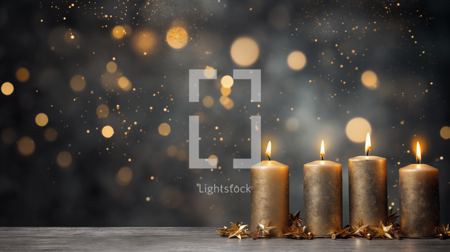 Four gold burning Christmas advent candles with bokeh. 
