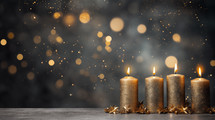 Four gold burning Christmas advent candles with bokeh. 