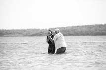 baptism of a woman in a lake 