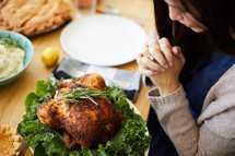 praying over thanksgiving dinner 