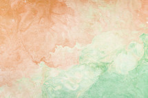 marbleized peach and green background 