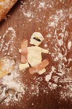 broken mummy cookie mended with band-aids.