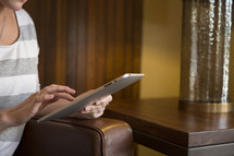 a woman using an iPad 