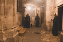Priests worship at the Church of the Holy Sepulchre.