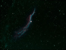 A delicate wispy nebula in outer space