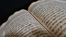 Close up of an ancient Hebrew text, or Torah