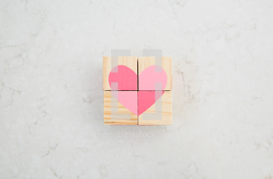 pink heart painted on wood blocks 