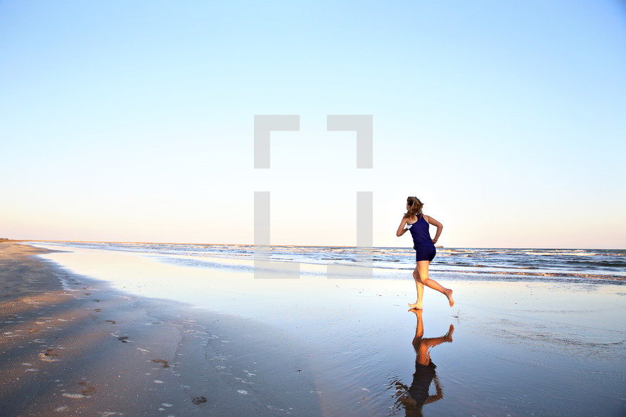 woman running on a beach 