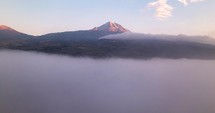 Mystical Sunrise Over Mountain Peaks and Sea of Clouds - Aerial View