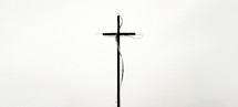 Cross silhouette on white background with copy space