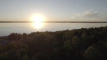 Drone shot of sunset on lake