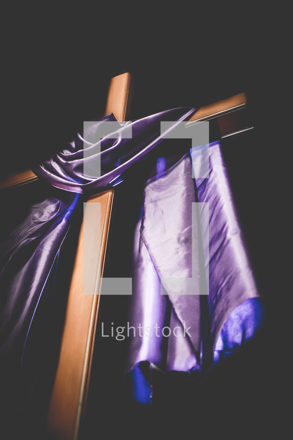 cross draped in purple for Lent 