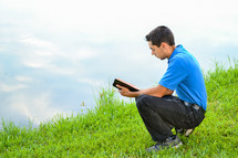 Young Man Reading the Bible