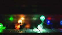 dark room with coloured lights on vintage piano
