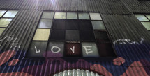 word love on a warehouse window 