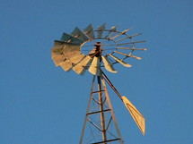 windmill against a blue sky 