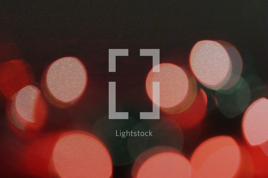 a textured and layered bokeh photo of lights
