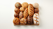 Top view of many different kinds of bread baked in the oven. 
