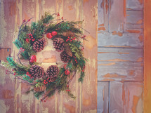 Christmas wreath decoration stock photo on colorful painted farmhouse door ideal for church social media and presentation backgrounds