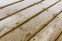 snow on wood boards on a deck 