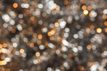 Silver and gold bokeh lights background 
