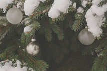 Christmas stock photo of a decorations, snow, pine tree ideal for a social media post idea, presentation slide background or church bulletin cover.
