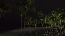 Timelapse of setting stars over a tropical beach