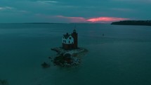 lighthouse island at dusk 