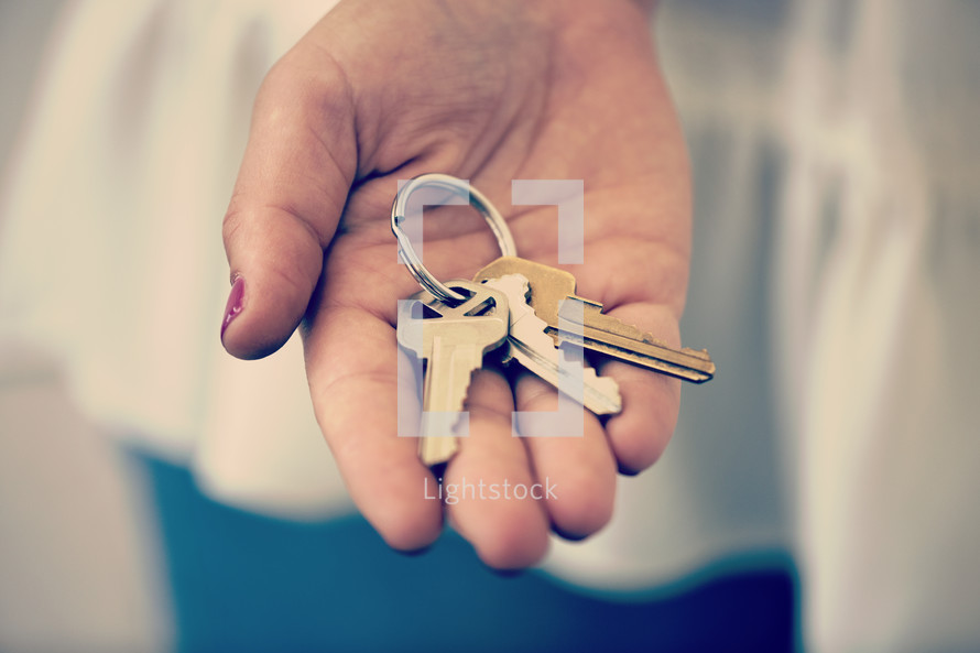 house keys in a woman's hand