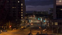 Timelapse of city traffic in a downtown area at night