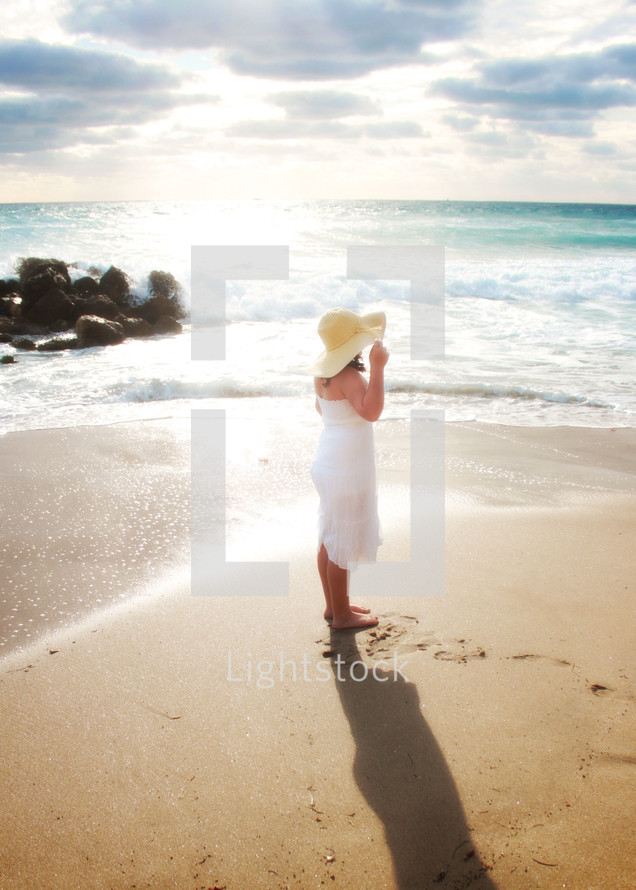 woman in a sun hat on a beach