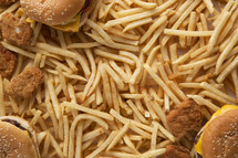 hamburger, french fries, and chicken nuggets background.
