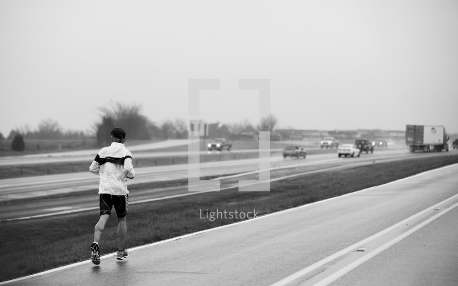 man running on a road
