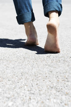 bare feet walking on concrete. 