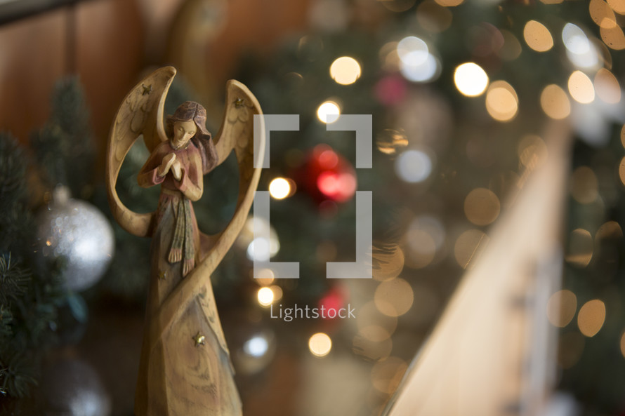Christmas angel with bokeh background.