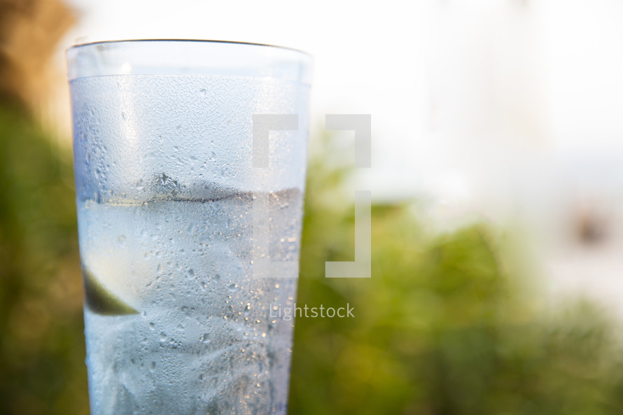 condensation on a glass of iced cold water 