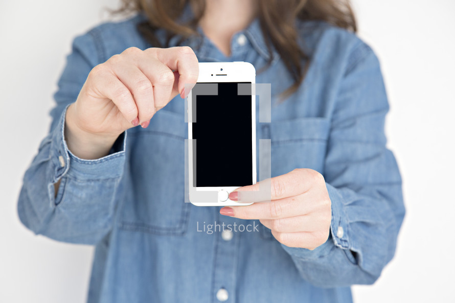 woman holding a cellphone 