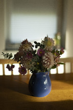 Flowers in a blue pitcher