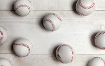 baseballs on a white wood background 