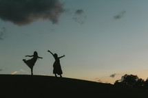 silhouette of dancers 