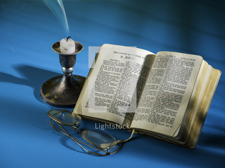 candlestick and open Bible - extinguished flame 