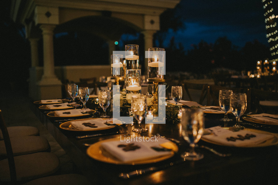 set table on a patio at night 