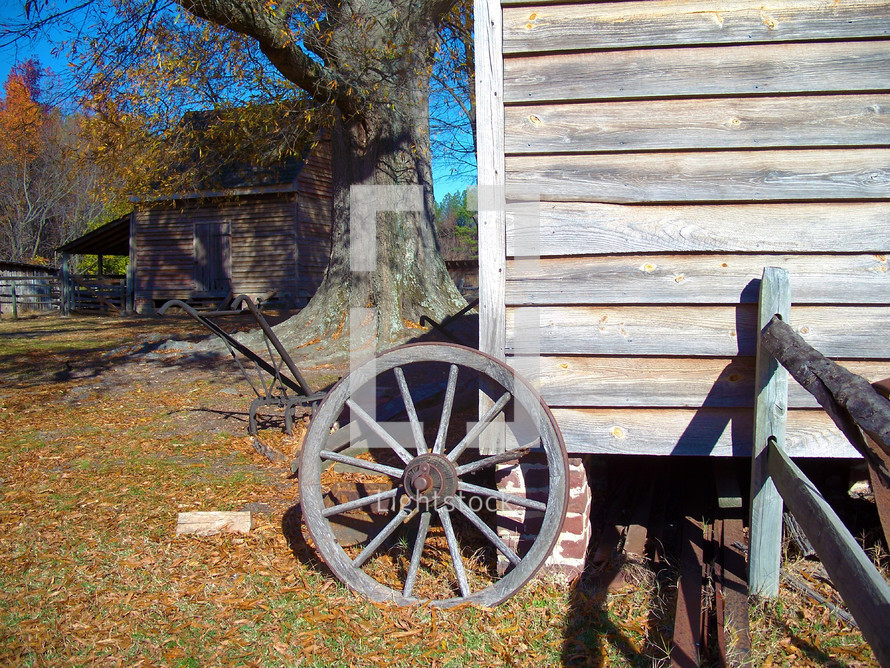autumn farm and wagon wheel at a ranch in Rural Virginia during the  fall season. 