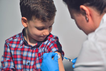 child receiving a vaccination 
