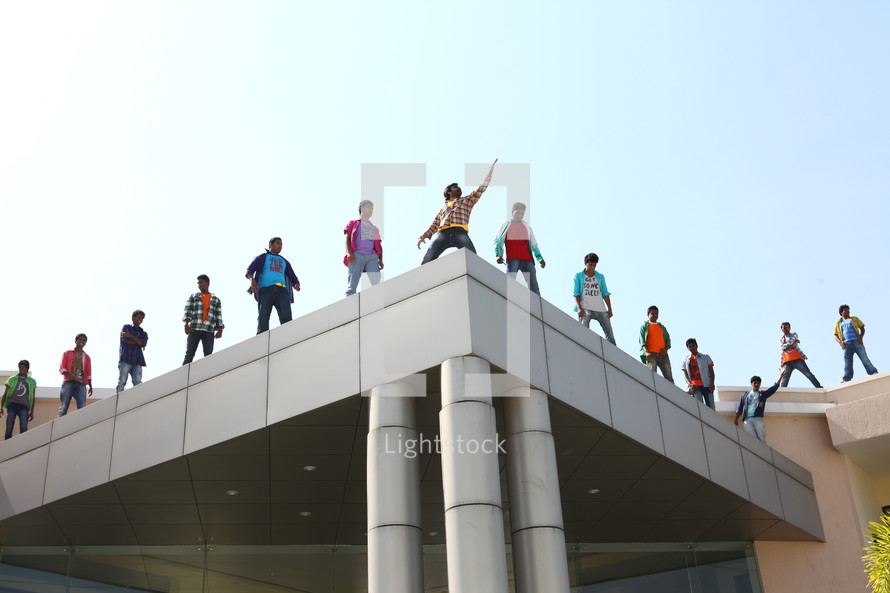 people standing on the roof of a building in India 