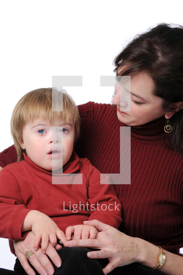woman holding a small boy in her arms