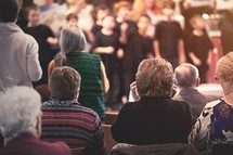 children's choir singing to a congregation 